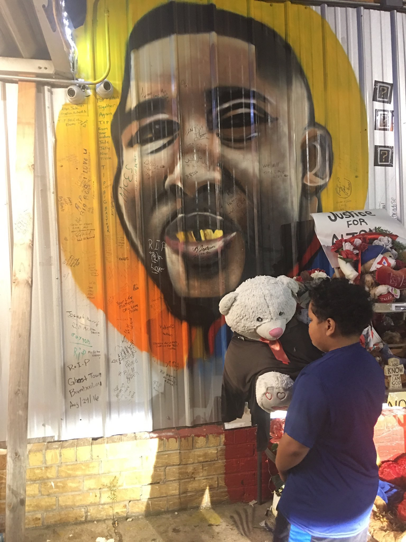 Dash, then 8; paying his respects to Alton Sterling at the Triple S Food Mart in Baton Rouge, La.